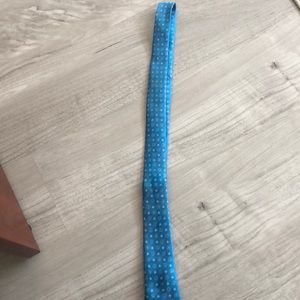 Boy’s turquoise tie